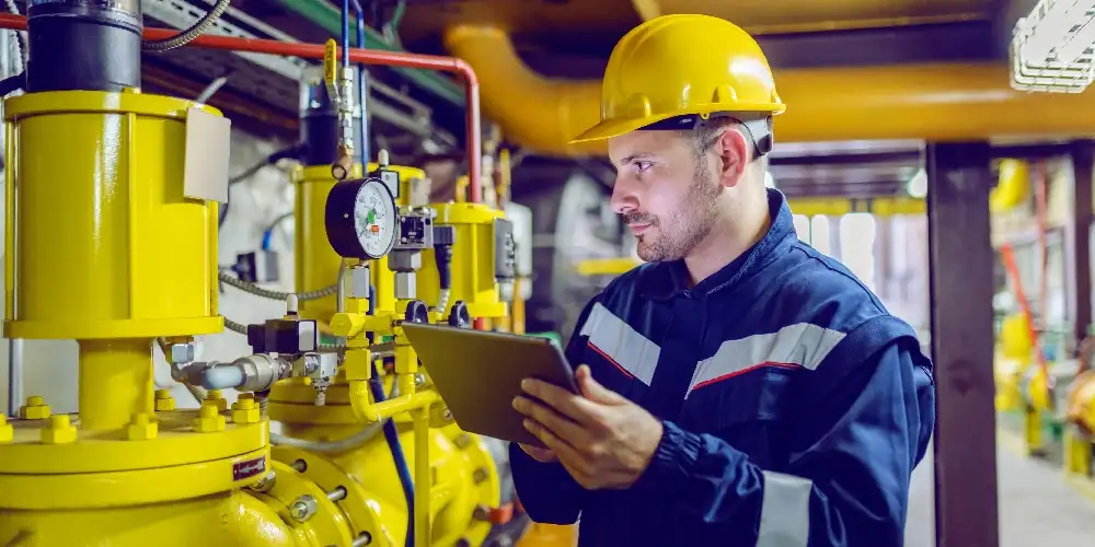 Engineer checking pumps