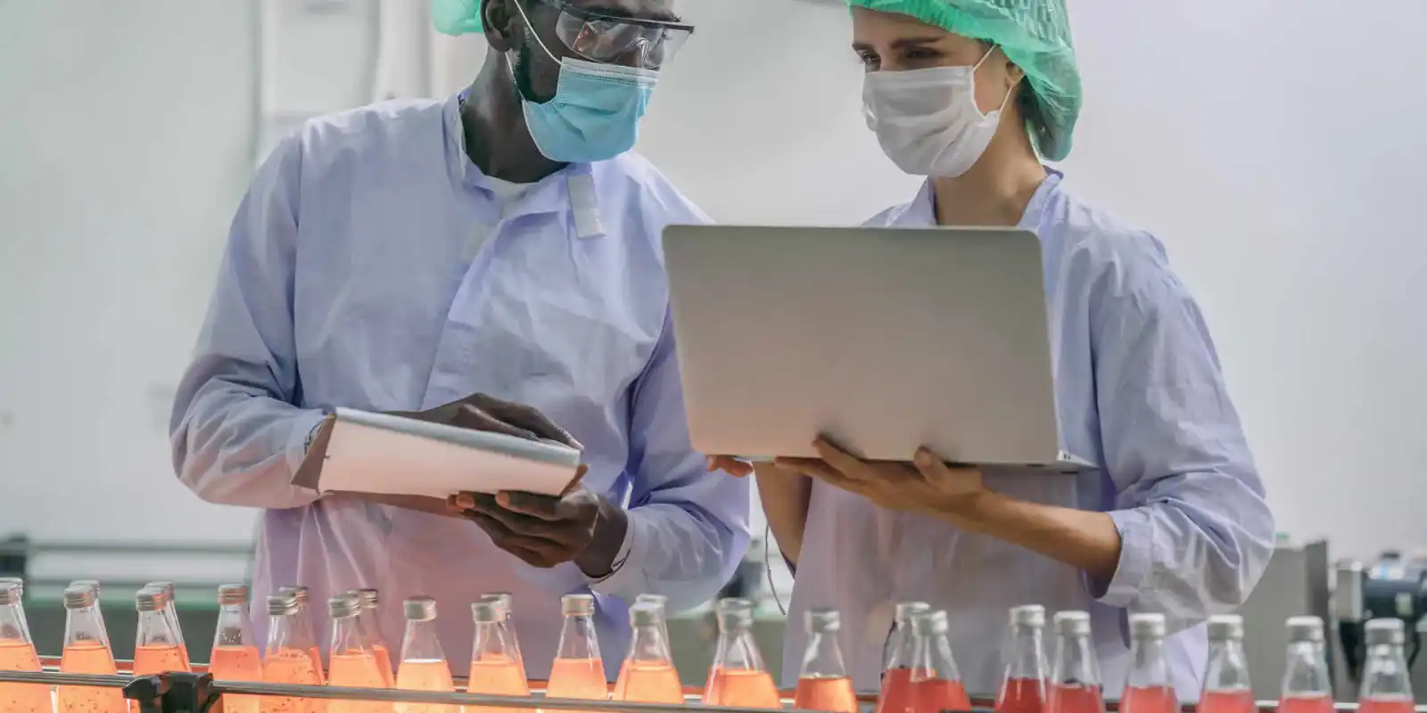 Engineers discussing bottling line